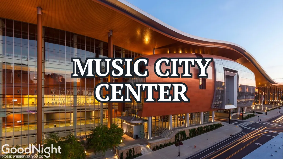 This image features the striking exterior of the Music City Center, showcasing its distinctive curved roof, expansive glass windows, and surrounding landscaping. The building is a hub for business conferences, exhibitions, and networking events, with an energetic and welcoming atmosphere set against the backdrop of downtown Nashville.