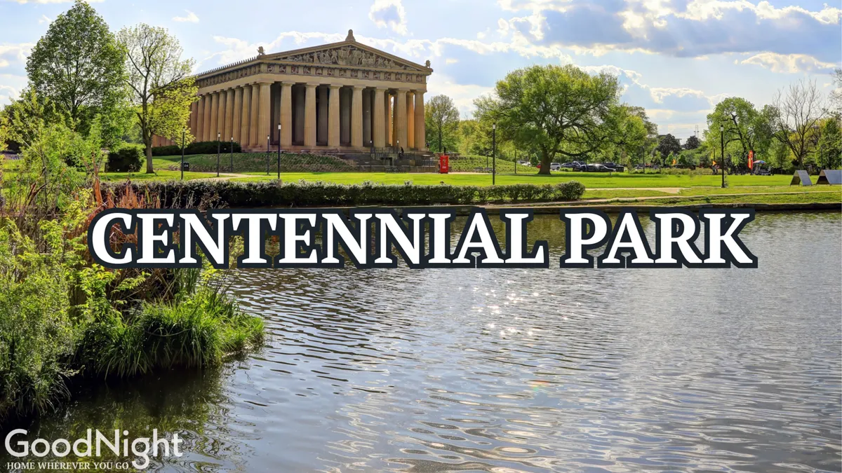 This image captures the iconic Parthenon-style building in Centennial Park, with a reflective water surface and lush greenery surrounding the area. The scene shows a vibrant yet peaceful public space, perfect for family outings, scenic walks, and city exploration.